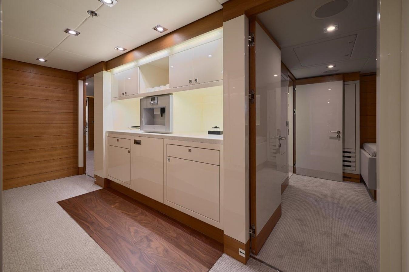 a room with white cabinets aboard EP150 Yacht for Sale