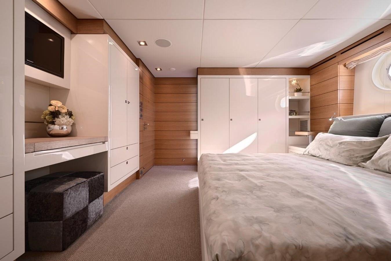 a bedroom with a fireplace aboard EP150 Yacht for Sale
