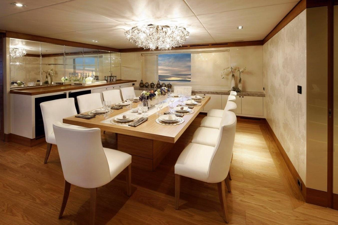 a large kitchen with a dining table aboard EP150 Yacht for Sale