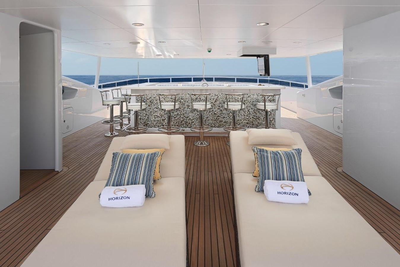 a room with a couch and a table aboard EP150 Yacht for Sale
