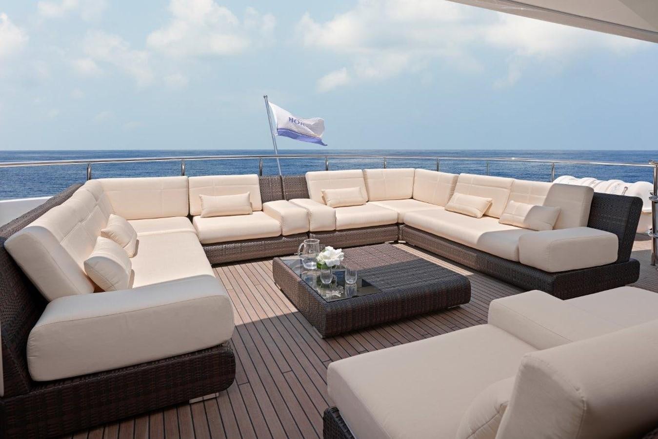 a living room with a large ocean aboard EP150 Yacht for Sale