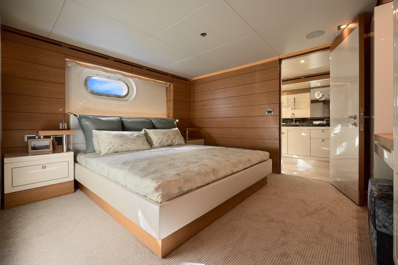 a bedroom with a bed and a closet aboard EP150 Yacht for Sale