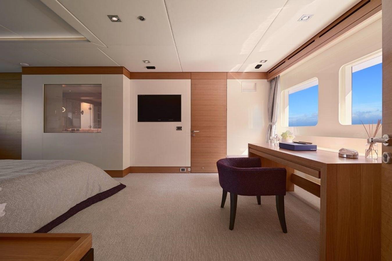 a room with a bed and a desk aboard EP150 Yacht for Sale