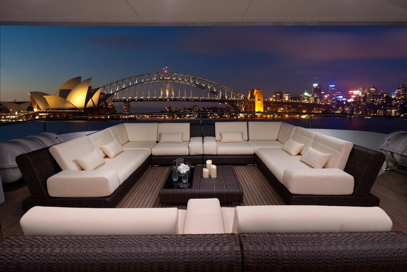 a large lounge area with a large city in the background aboard EP150 Yacht for Sale