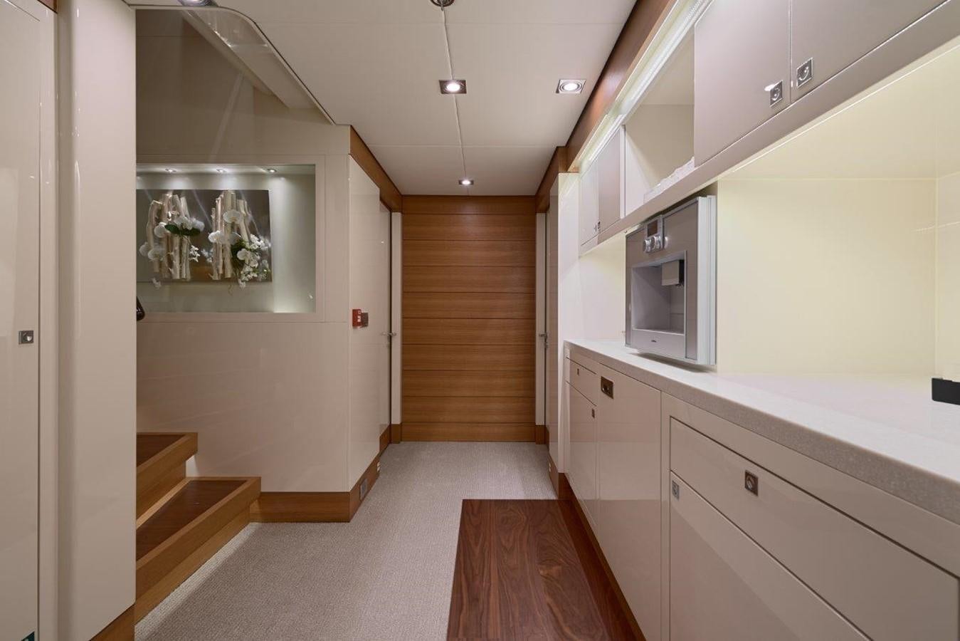 a room with a wood floor and white cabinets aboard EP150 Yacht for Sale