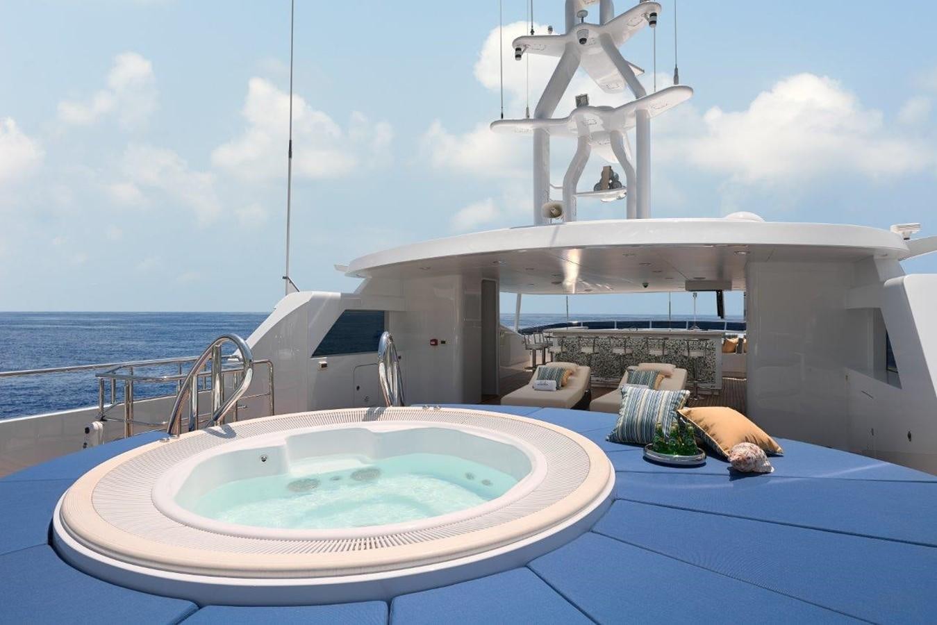 a large white boat on a body of water aboard EP150 Yacht for Sale