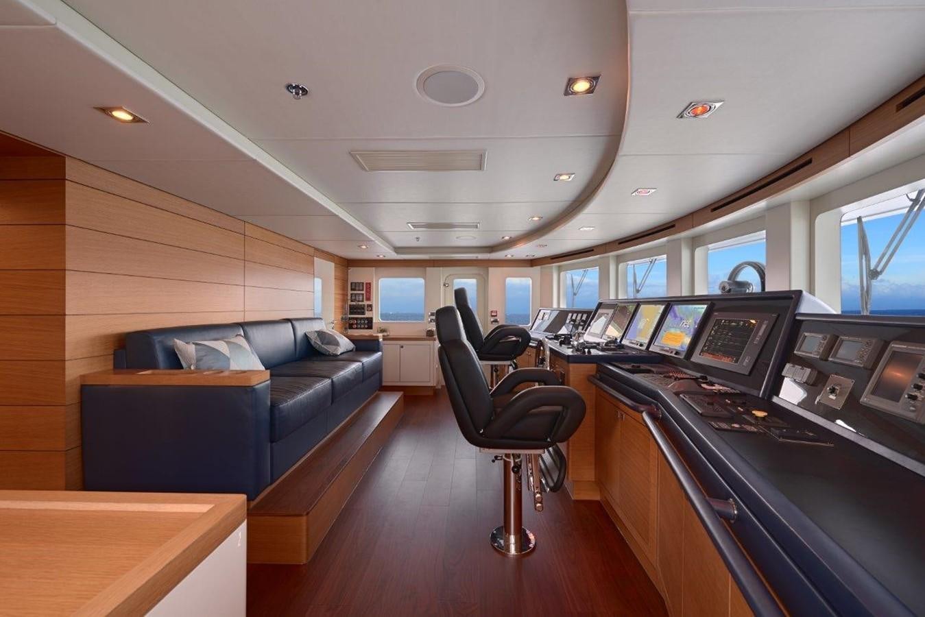 a room with a desk and chairs aboard EP150 Yacht for Sale