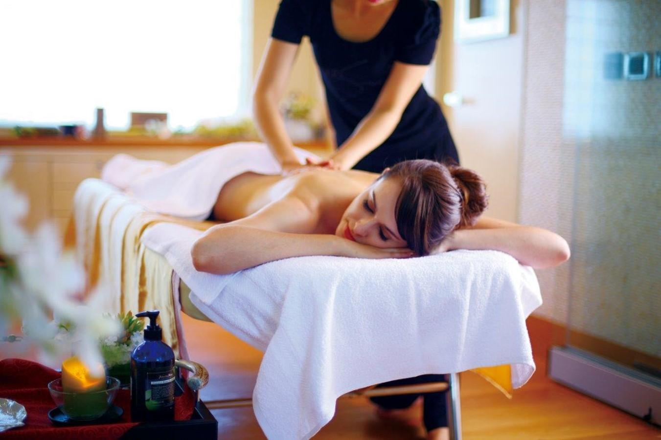 a woman lying on a bed aboard EP150 Yacht for Sale