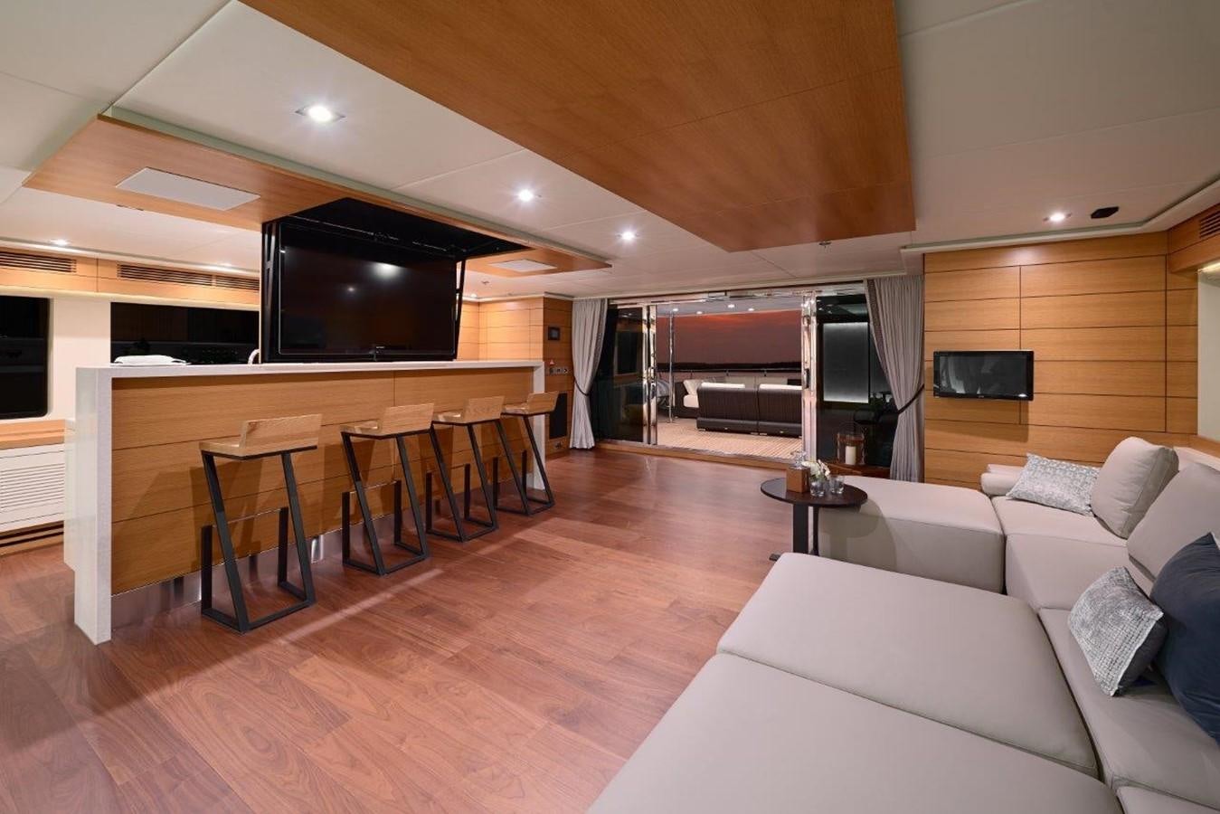 a living room with a wood floor aboard EP150 Yacht for Sale
