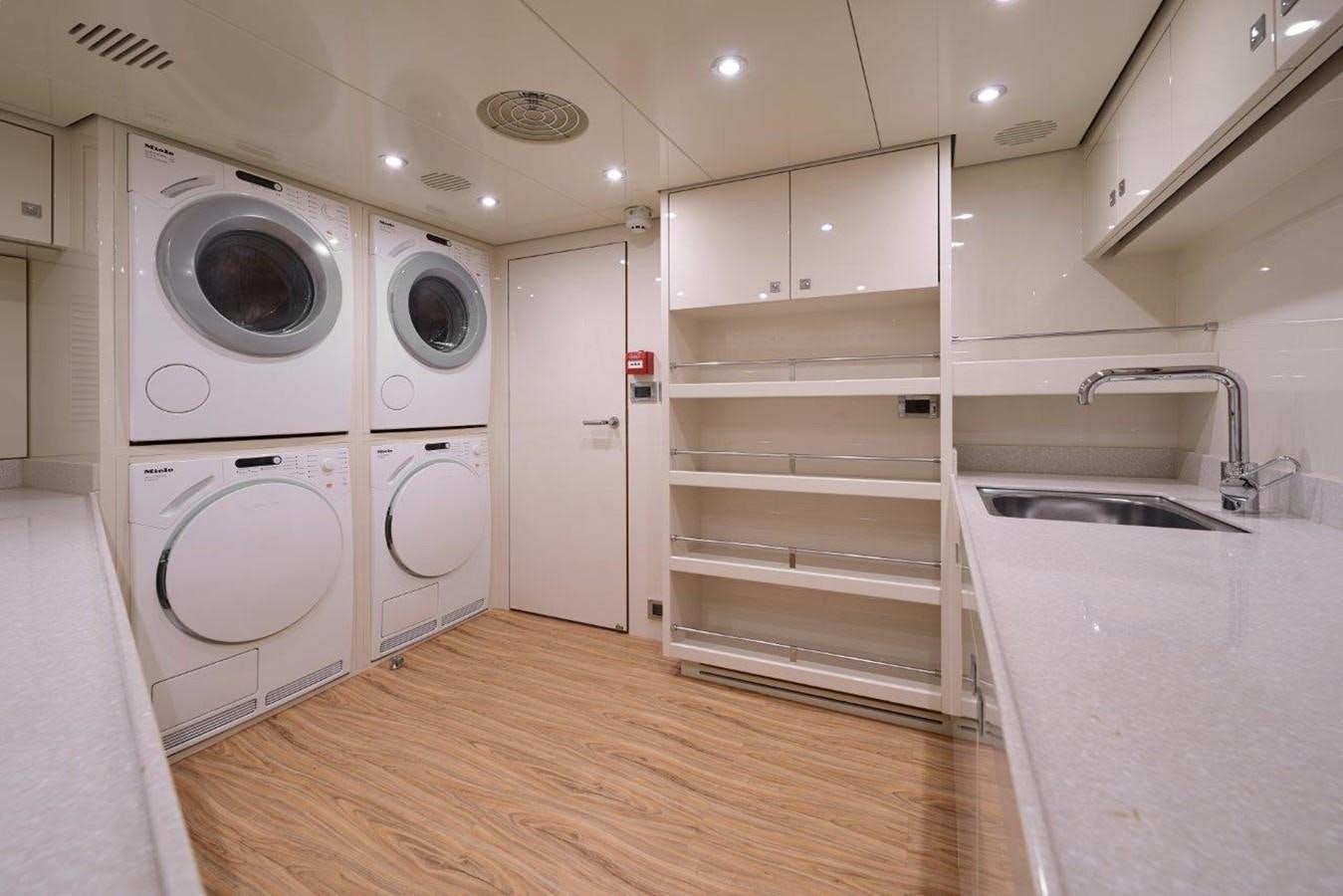 a room with washer and dryer aboard EP150 Yacht for Sale