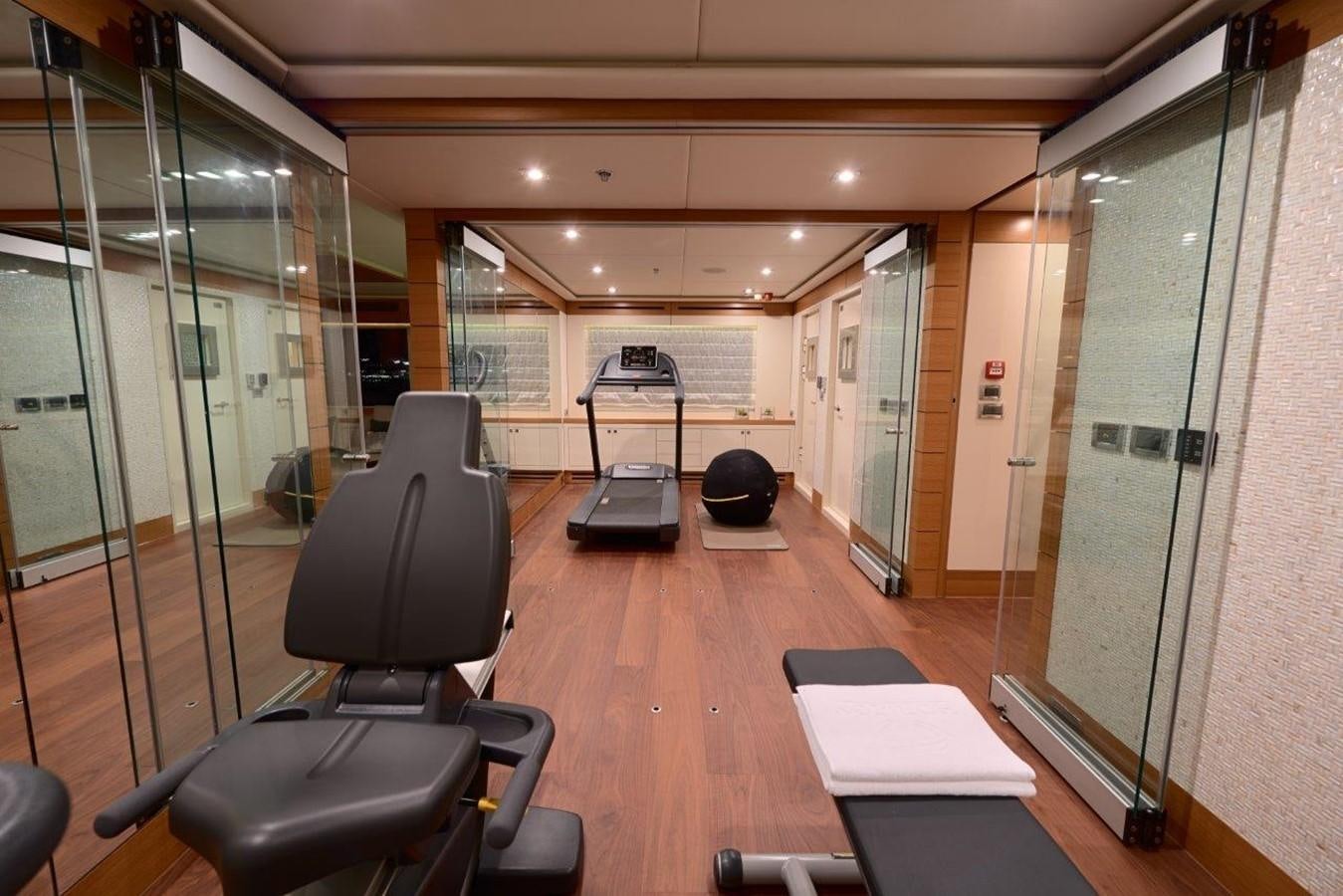 a room with a table chairs and a large glass door aboard EP150 Yacht for Sale