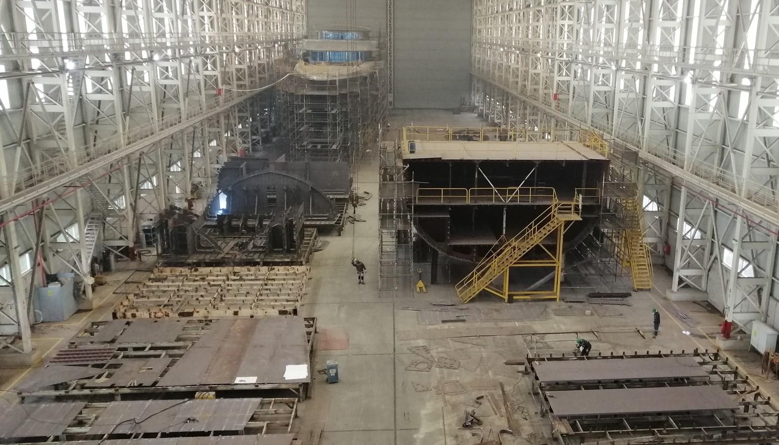 a large factory with a black train aboard VITRUVIUS Yacht for Sale