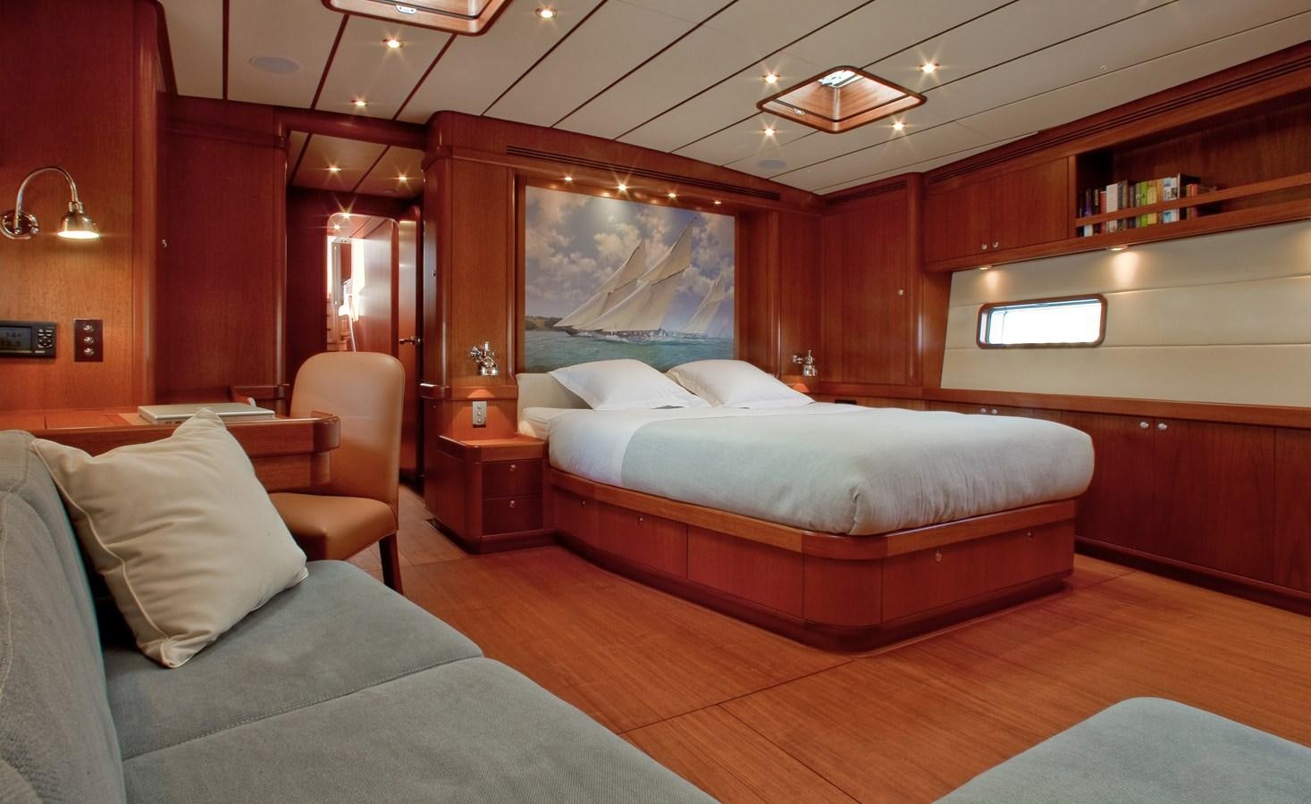 a room with a bed and a chair aboard SHAGALA BAGALA Yacht for Sale