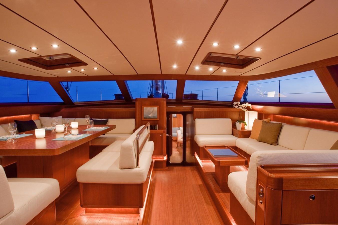 a room with a table chairs and a couch aboard SHAGALA BAGALA Yacht for Sale