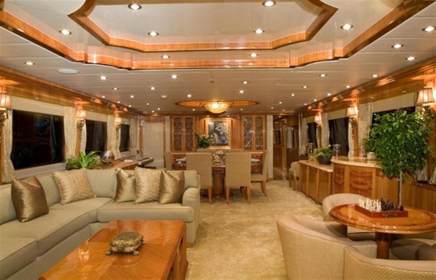 a living room with a couch and a table aboard SEA LEGEND Yacht for Sale