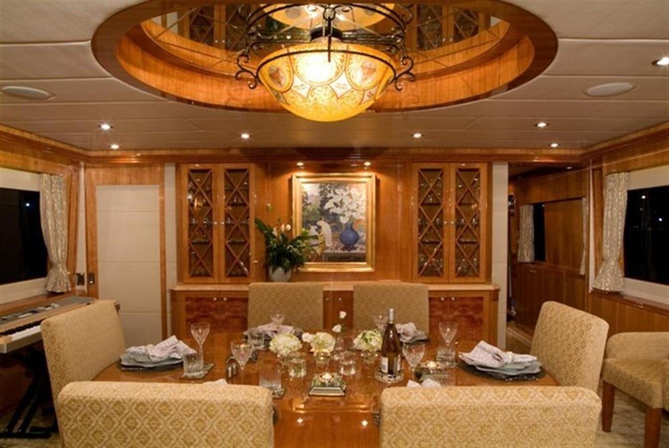 a dining room with a table and chairs aboard SEA LEGEND Yacht for Sale