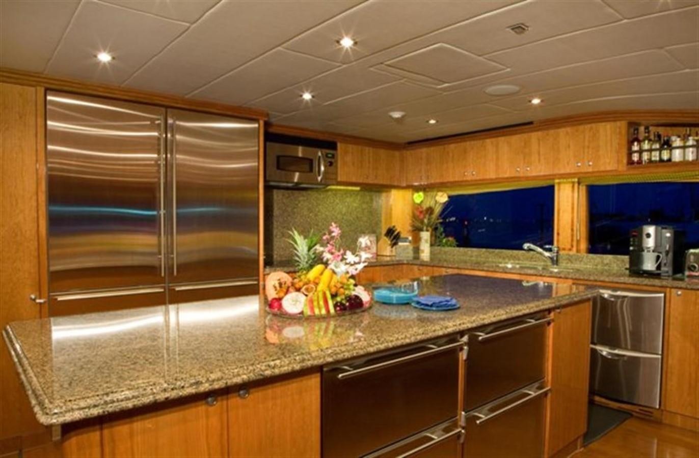 a kitchen with a large island aboard SEA LEGEND Yacht for Sale