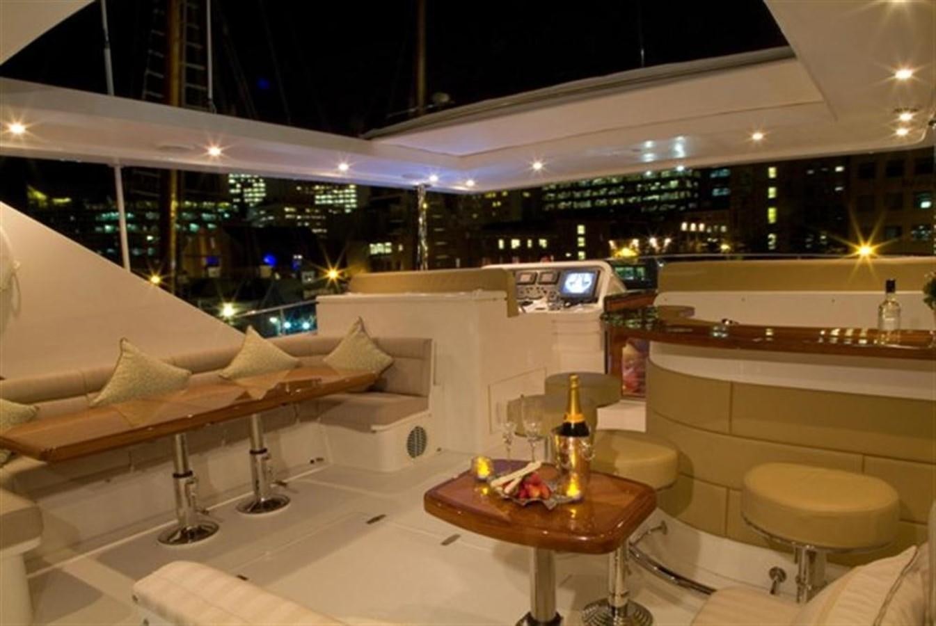 a room with a table and chairs aboard SEA LEGEND Yacht for Sale