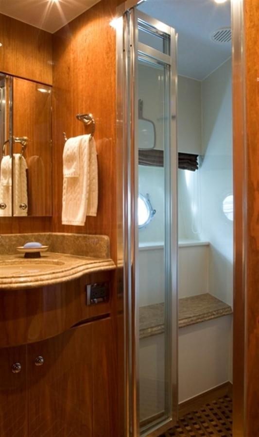a bathroom with a glass shower aboard SEA LEGEND Yacht for Sale