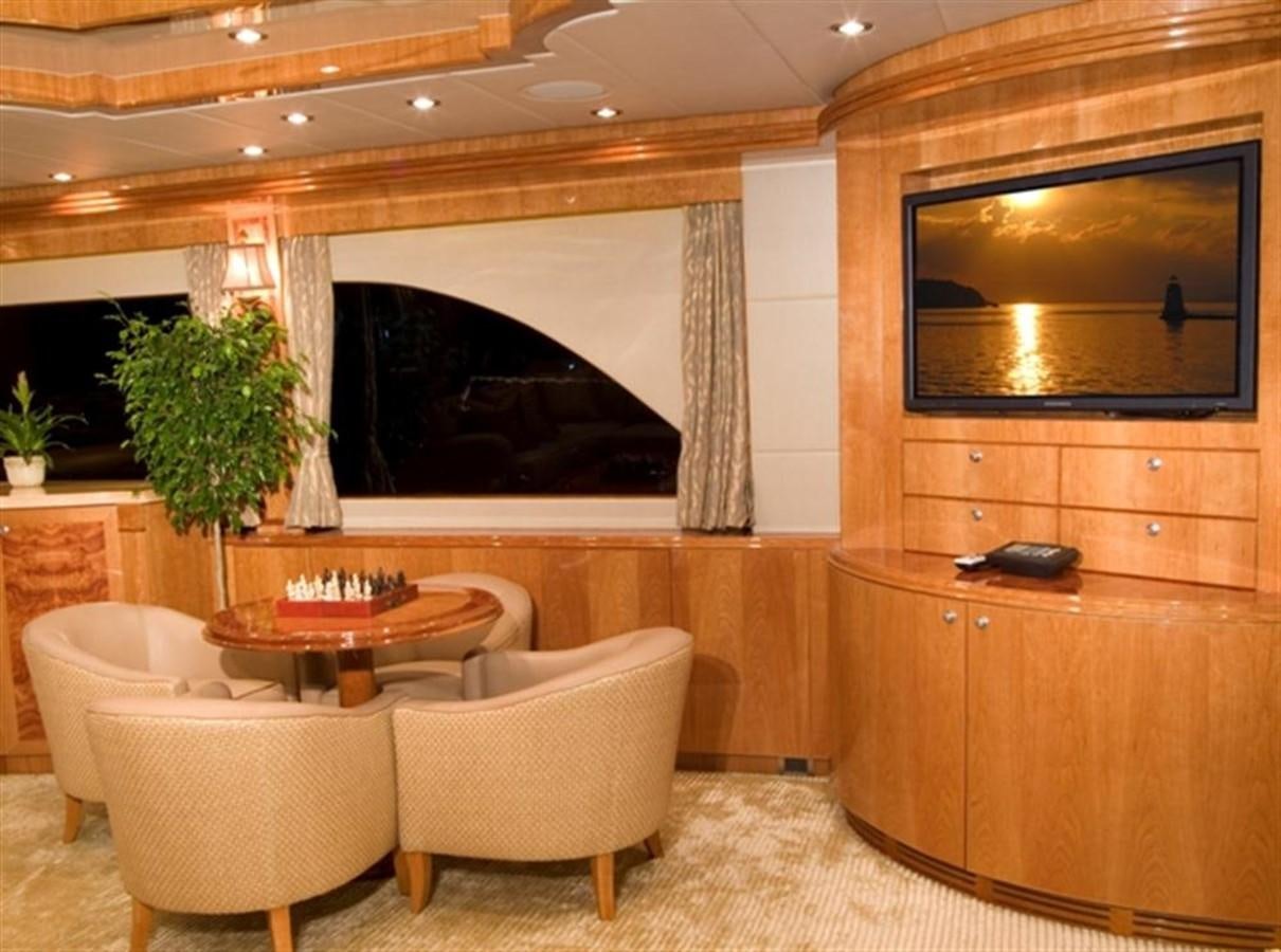 a room with a table and chairs aboard SEA LEGEND Yacht for Sale