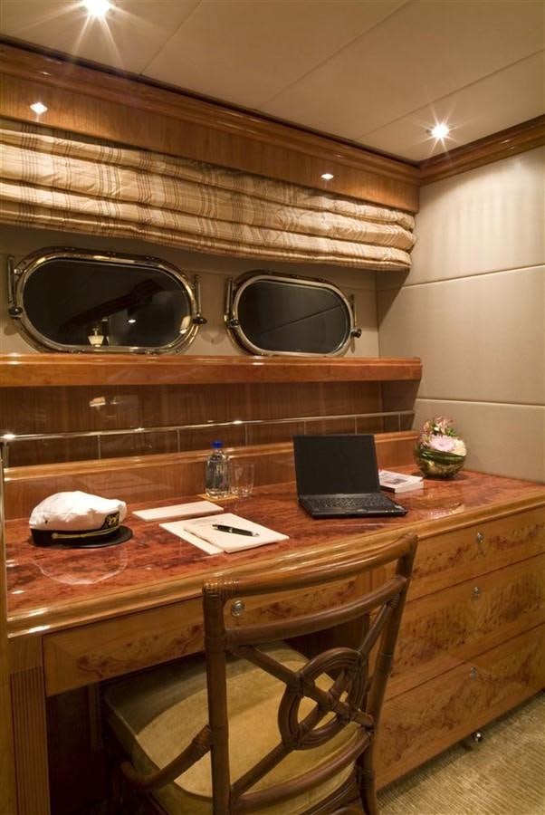 a laptop sits on a table aboard SEA LEGEND Yacht for Sale