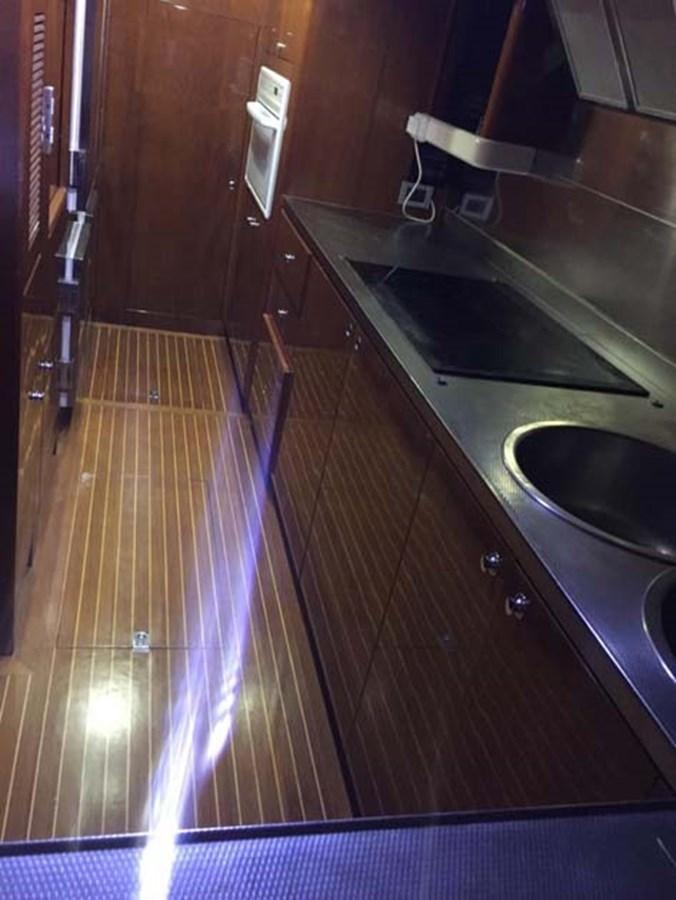 a kitchen with a large stainless steel sink aboard AEGINA Yacht for Sale