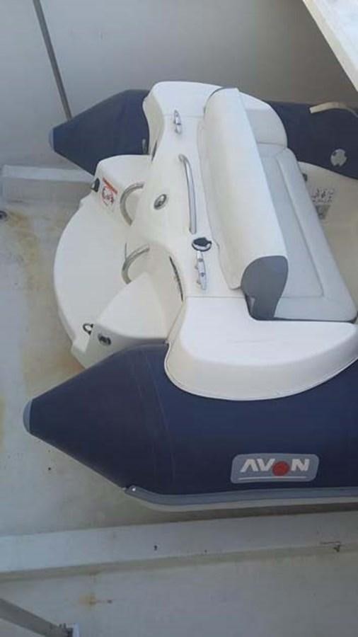 a white toilet with a seat belt aboard AEGINA Yacht for Sale