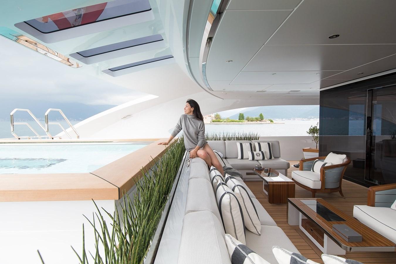 a person sitting on a couch aboard GAJA Yacht for Sale