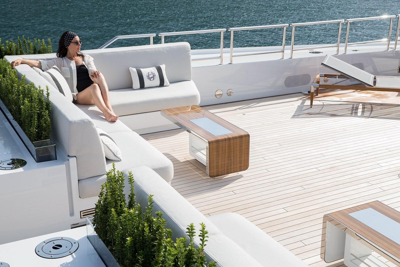 a person sitting on a balcony aboard GAJA Yacht for Sale
