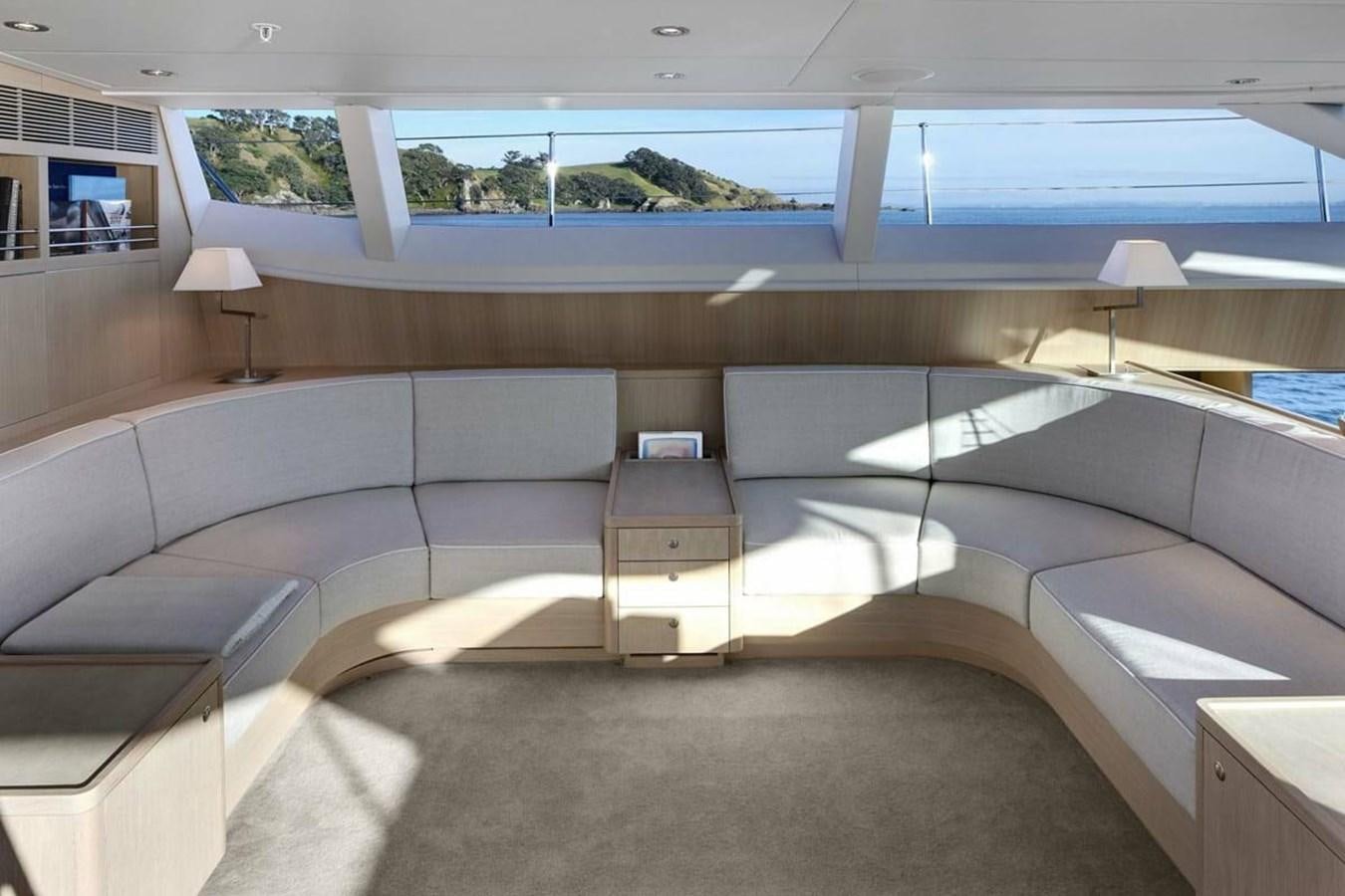 a large room with a couch and a table aboard IMAGINE D Yacht for Sale