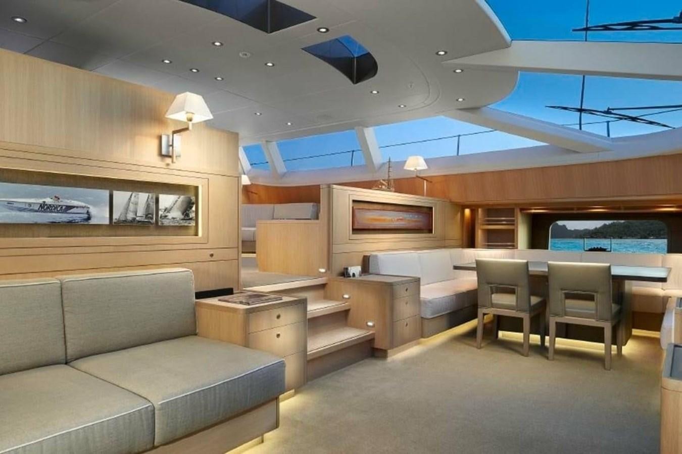 a room with a couch and a table and chairs aboard IMAGINE D Yacht for Sale