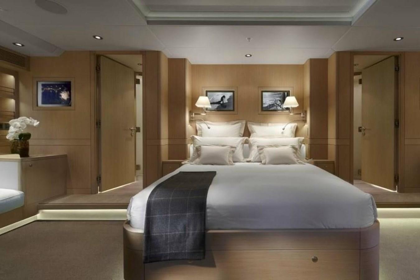 a large bed in a hotel room aboard IMAGINE D Yacht for Sale
