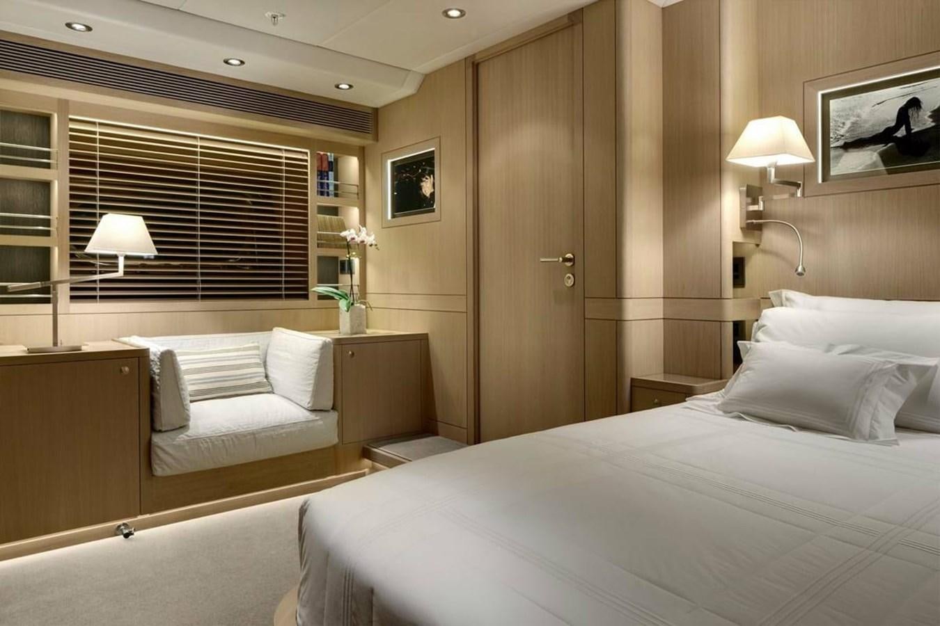 a hotel room with a bed and a couch aboard IMAGINE D Yacht for Sale