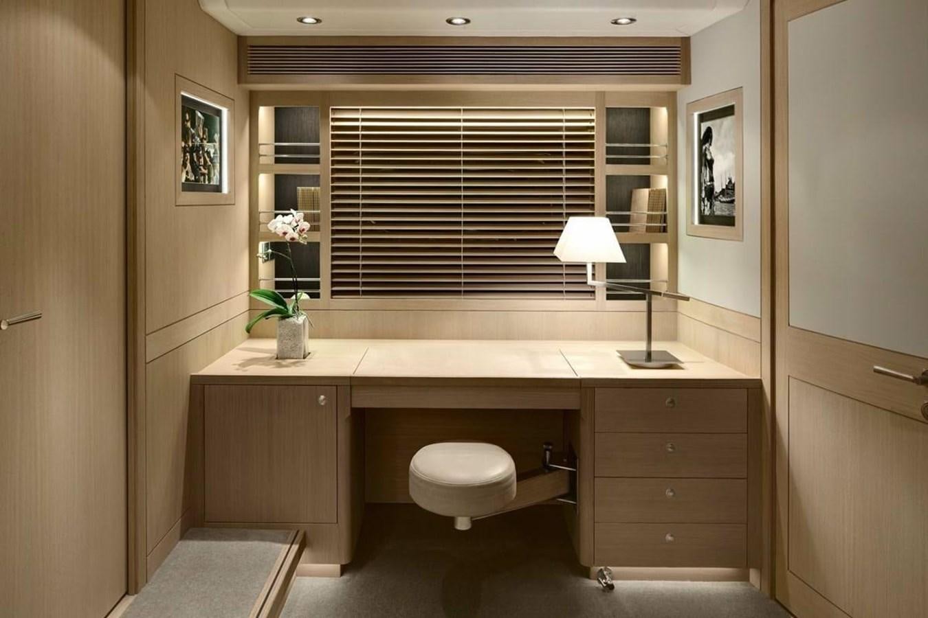 a bathroom with a desk and a window aboard IMAGINE D Yacht for Sale