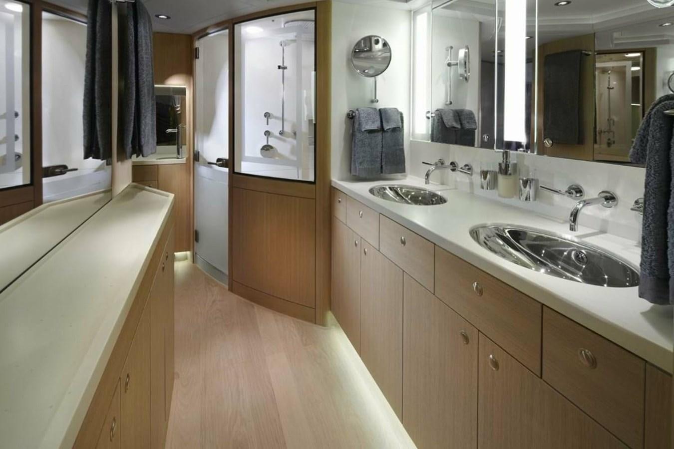 a bathroom with a sink and a mirror aboard IMAGINE D Yacht for Sale