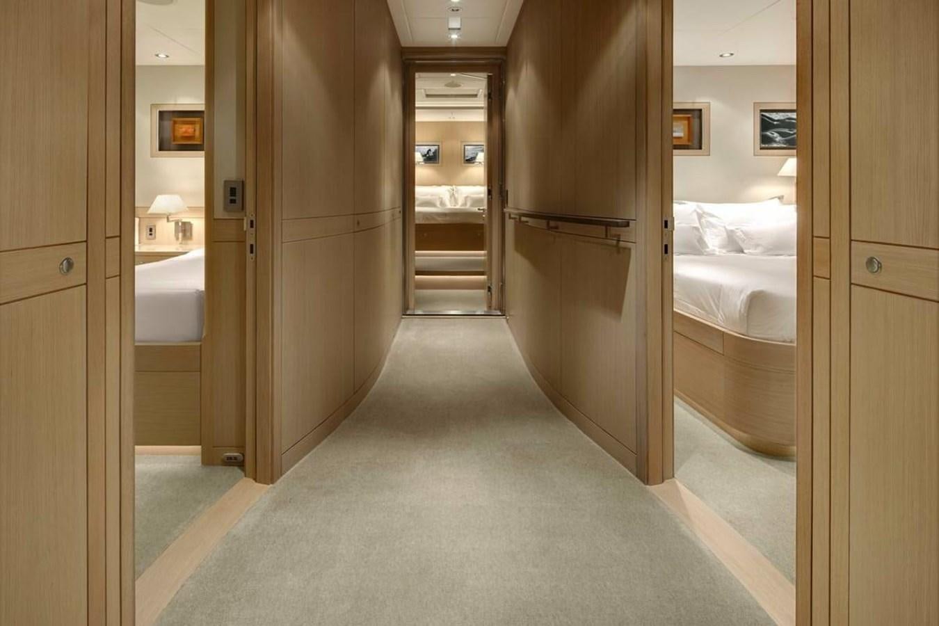 a room with a bed and a closet aboard IMAGINE D Yacht for Sale