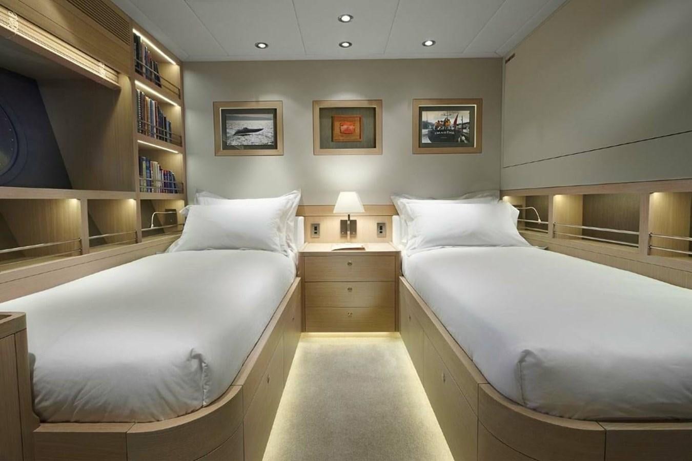 a room with a couple of beds aboard IMAGINE D Yacht for Sale