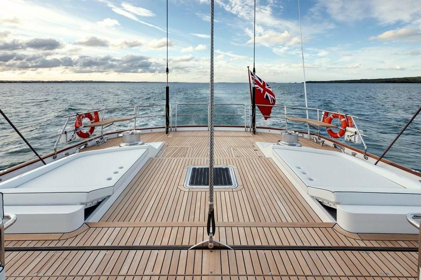 a boat with a flag on it aboard IMAGINE D Yacht for Sale