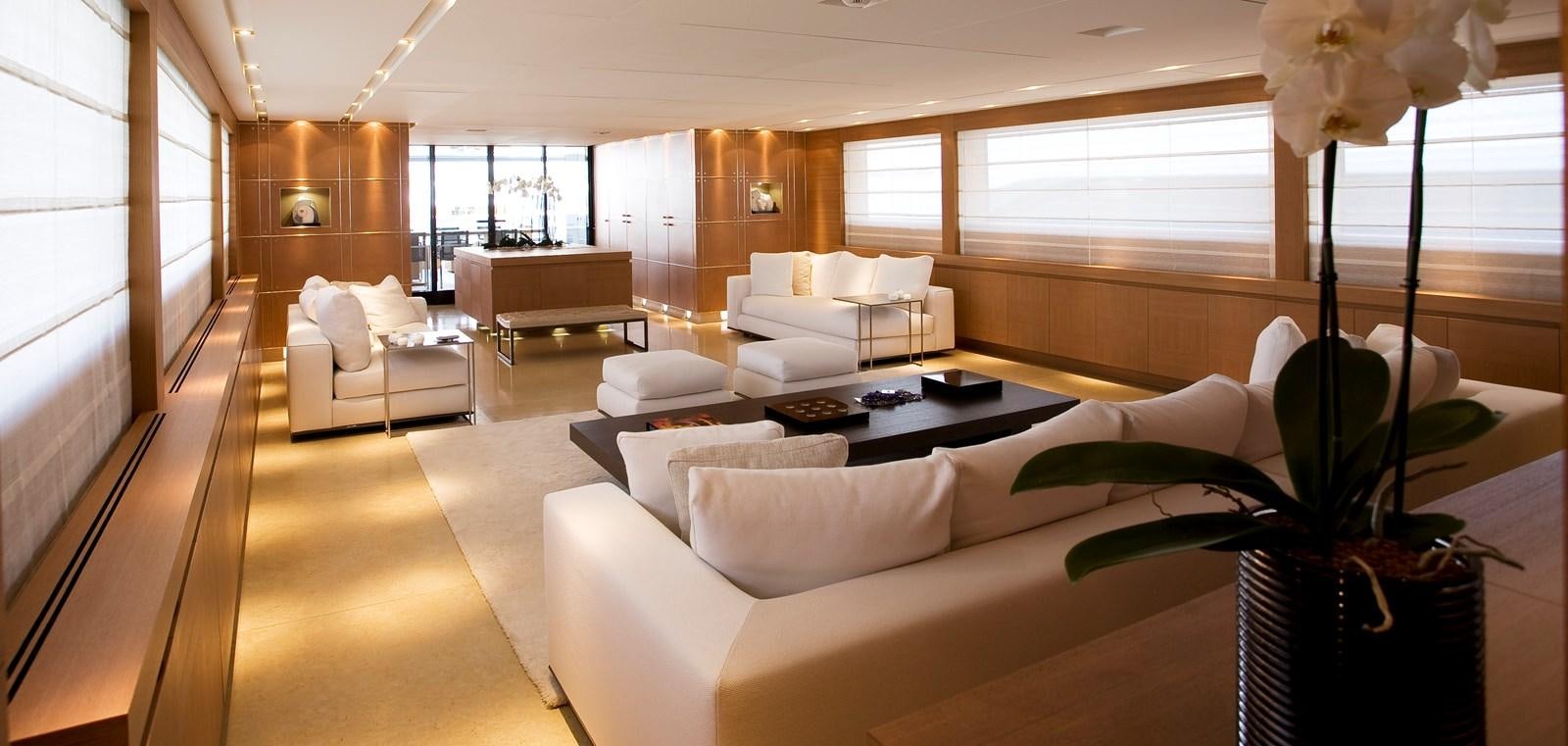 a living room with a large mirror aboard QUEEN BLUE Yacht for Sale