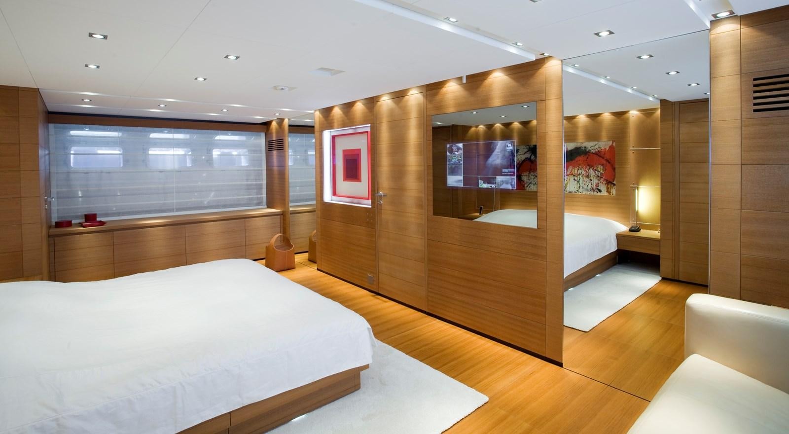 a room with a bed and a wood wall aboard QUEEN BLUE Yacht for Sale