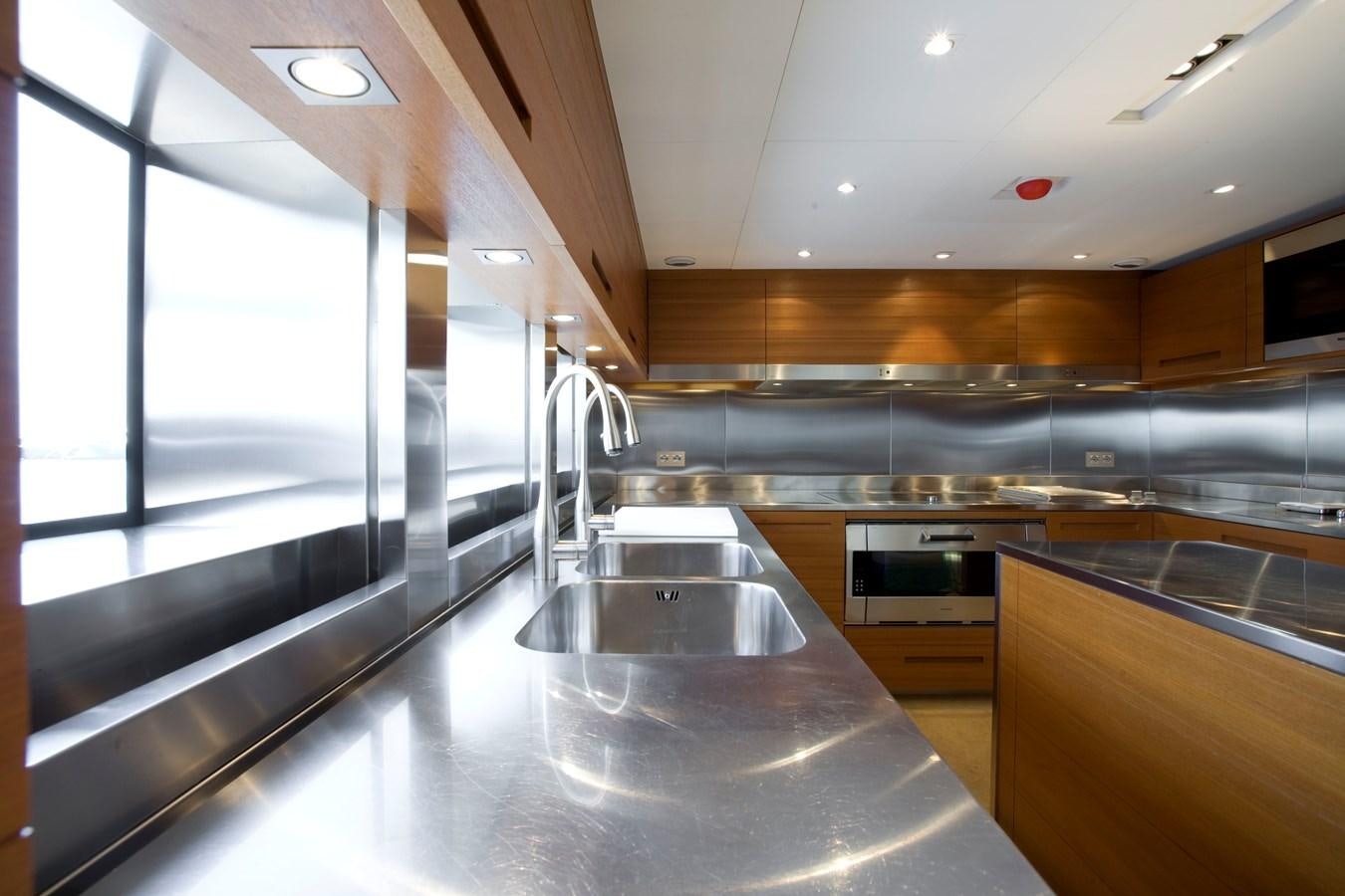 a kitchen with a large island aboard QUEEN BLUE Yacht for Sale