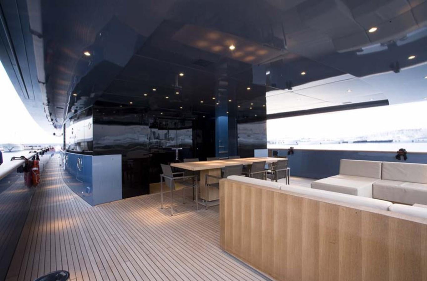 a room with a table and chairs aboard QUEEN BLUE Yacht for Sale