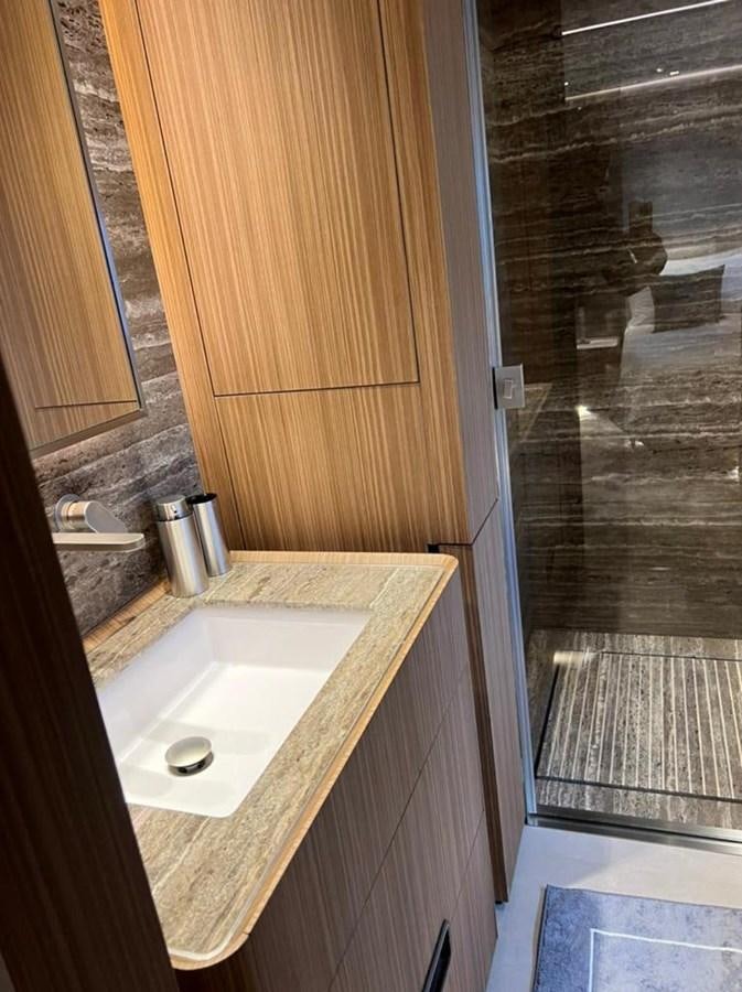 a bathroom with a sink and a shower aboard RANDY BETH Yacht for Sale