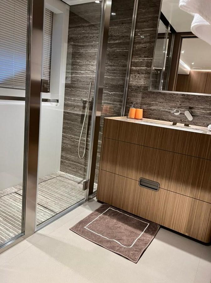 a bathroom with a glass shower aboard RANDY BETH Yacht for Sale