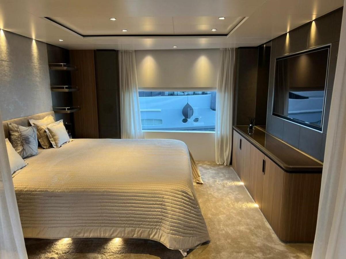 a bedroom with a bed and a tv aboard RANDY BETH Yacht for Sale