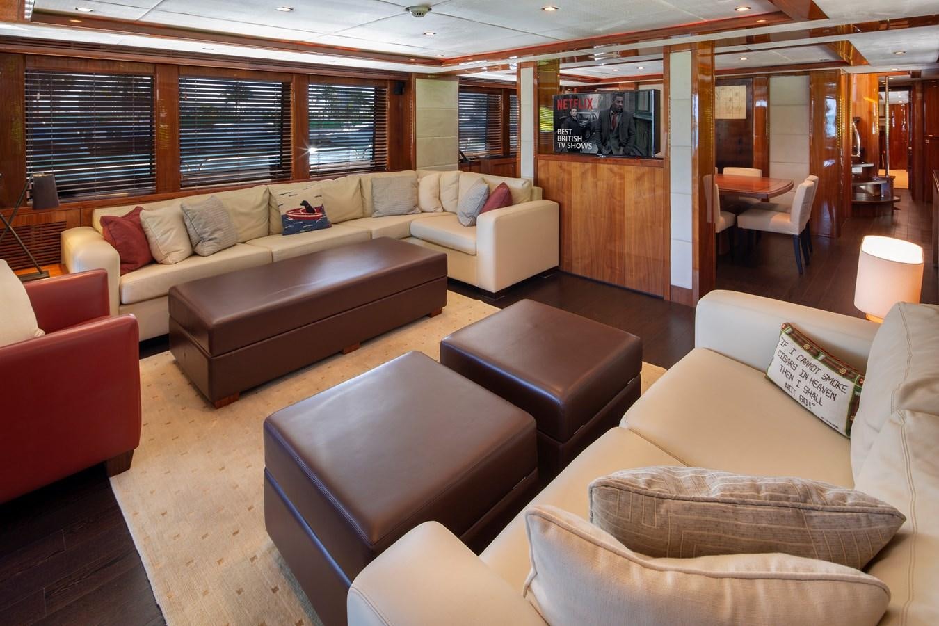 a living room with a couch and a tv aboard 2010 SUNSEEKER 34M  @ AVENTURA FL Yacht for Sale
