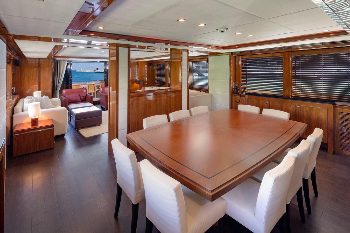 a large room with a table and chairs aboard 2010 SUNSEEKER 34M  @ AVENTURA FL Yacht for Sale