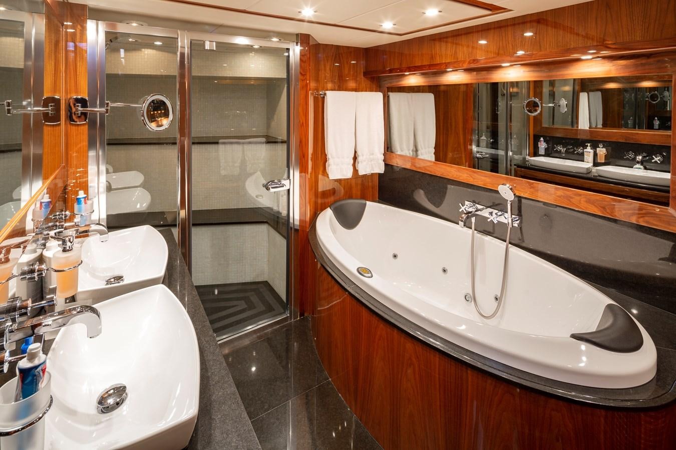a bathroom with a large mirror aboard 2010 SUNSEEKER 34M  @ AVENTURA FL Yacht for Sale