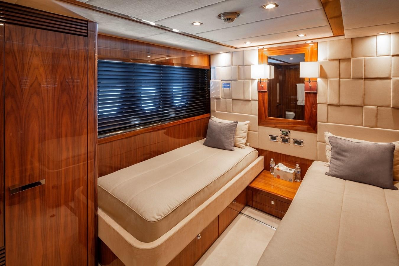 a room with a bed and a mirror aboard 2010 SUNSEEKER 34M  @ AVENTURA FL Yacht for Sale