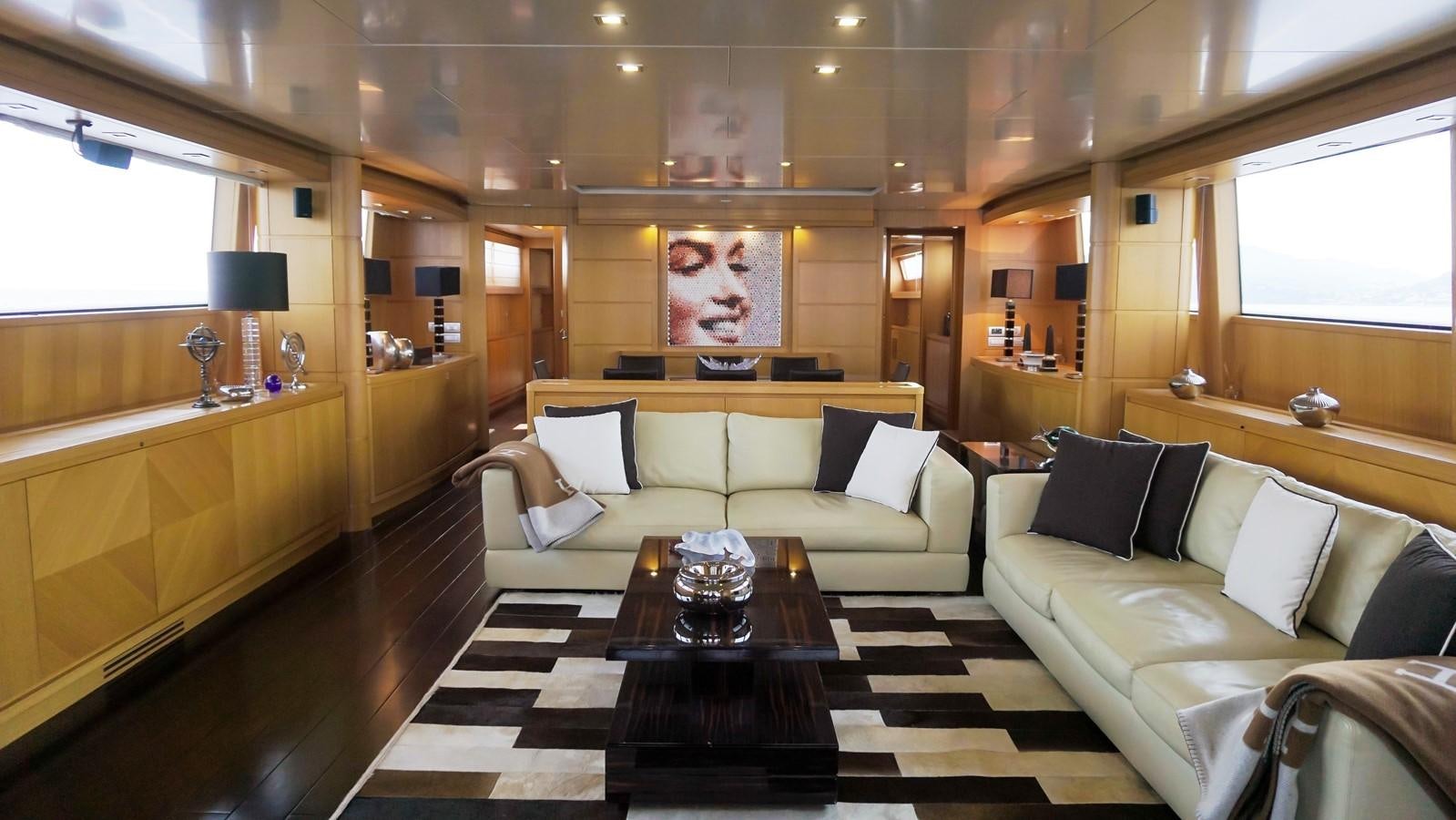 a living room with a large sofa aboard PETRUS Yacht for Sale